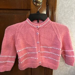 Hand-knit, one-of-a-kind, baby girl sweater.